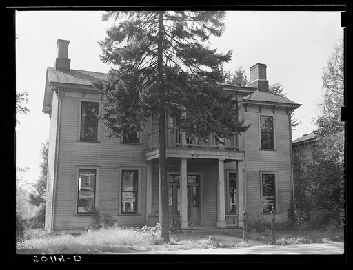 Once a private home, now left part of building used for FSA (Farm Security Administration) offices. The other half is a photographer's studio. Elkins West Virginia