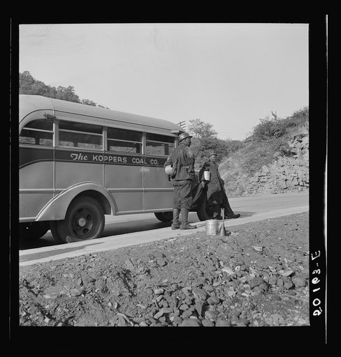 Untitled photo, possibly related to: Coal miners waiting along road for bus to take them home. In Welch, Bluefield section, West Virginia