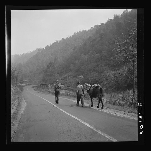 Miners returning home along main county road with provisions. Mohegan, West Virginia