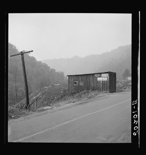 Untitled photo, possibly related to: Shack by burning slag heap on main country road near Mohegan, West Virginia
