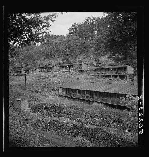 Coal miners' homes, company houses, with piles of old slag and slate. "The Patch," Cassville, West Virginia