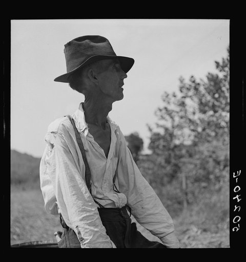 Badly wounded and gassed in world war. Racine, West Virginia. Watching sorghum mill operations