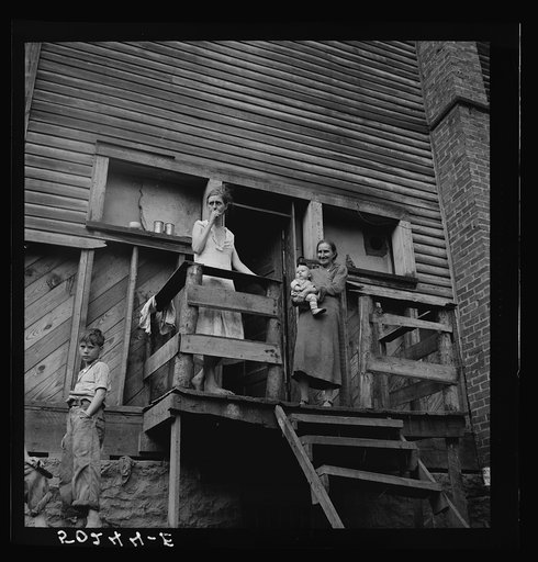 Wife of unemployed miner with her mother and two children. Marine, West Virginia