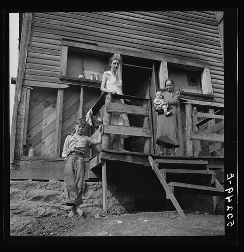 Untitled photo, possibly related to: Wife of unemployed miner with her mother and two children. Marine, West Virginia