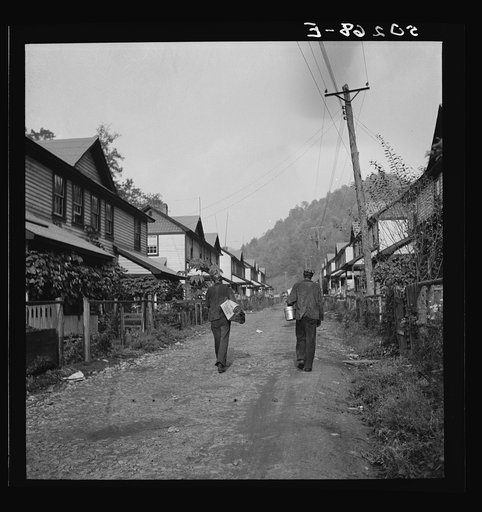 Coal miners going home. Company houses, Capels, West Virginia
