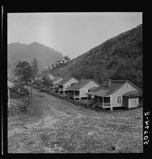 Boarded-up homes in abandoned mining town. Twin Branch, West Virginia. Once very nice, owned by Ford. About four years ago when an attempt to organize it was made, Ford closed it down completely rather than have it unionized. Around 1000 men used to work there. They won't sell it, rent or let "squat