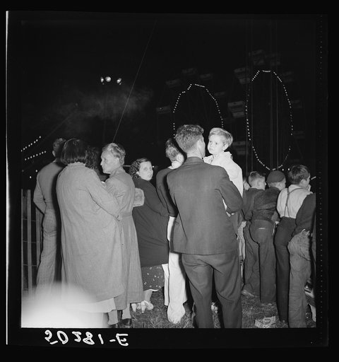 Coal miners and their families all turn out for carnival, once a year.  Granville, West Virginia. They are watching the aerial trapeze artists