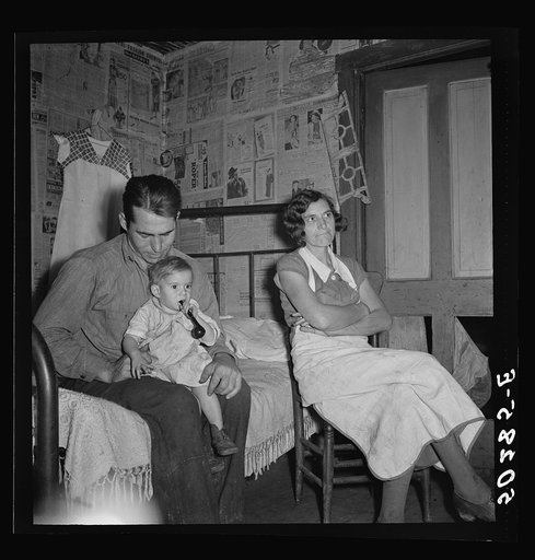 Untitled photo, possibly related to: Coal miner, his wife and one of their many children. Bertha Hill, West Virginia