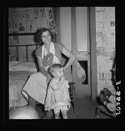 Untitled photo, possibly related to: Coal miner's wife and child while discussing conditions of house, lack of steady work for husband. Bertha Hill, West Virginia