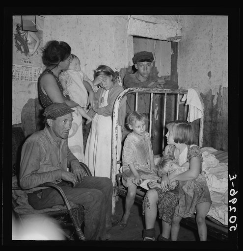 Untitled photo, possibly related to: Coal miner and wife and children. He has been injured in mines four times. Since last year, has been refused work, now is on relief. Pursglove, Scotts Run, West Virginia