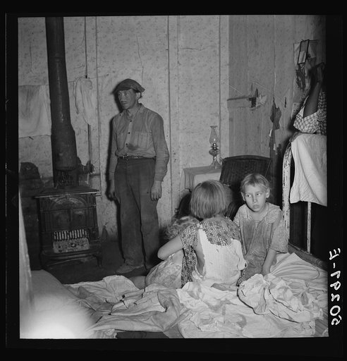 Coal miner and three of his children. Pusglove, West Virginia. See 50294-E