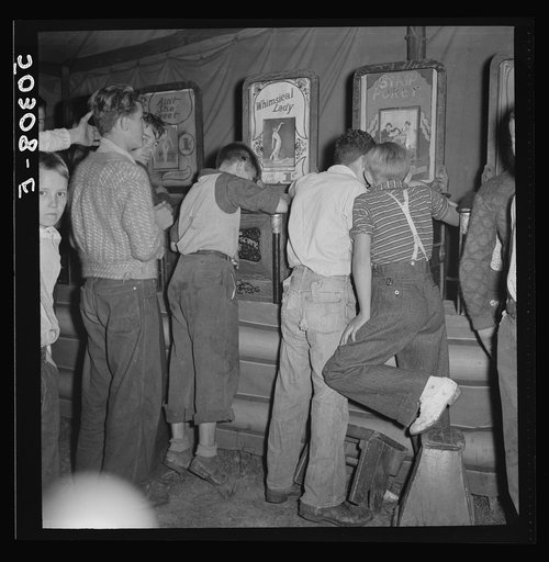 "It's a dirty jip," say the mine workers' sons in the penny arcade at outdoor carnival. Granville, West Virginia