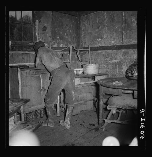 Coal miner in his home, a company house. Pursglove, Scotts' Run, West Virginia