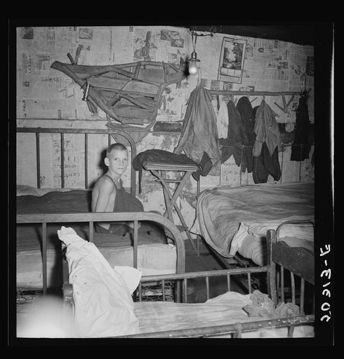 Coal miner's son in bedroom of company house. Pursglove, Scotts Run, West Virginia