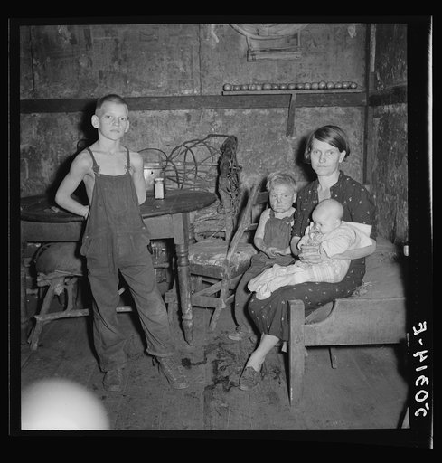 Coal miner's wife and three of their children. Company house, Pursglove, Scotts Run, West Virginia