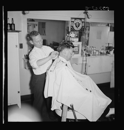 The barber is also the Justice of Peace in mining town of Osage, West Virginia