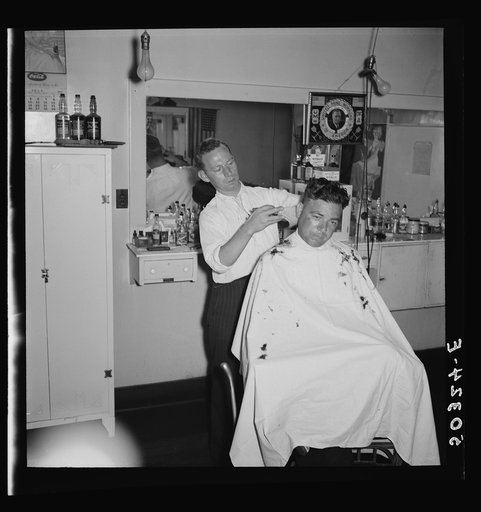 Untitled photo, possibly related to: The barber is also the Justice of Peace in mining town of Osage, West Virginia