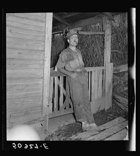 Untitled photo, possibly related to: Coal miner (Italian) resting and smoking his pipe after coming home from work. "The Patch," Chaplin, West Virginia