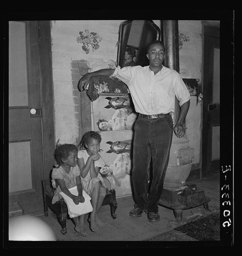 Coal miner and two of his seven children. He has worked in the mines for about twenty years. Chaplin, West Virginia