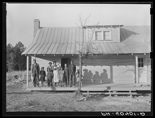 Untitled photo, possibly related to: Negro family (rehabilitation clients) on porch of new home they are building near Raleigh, North Carolina