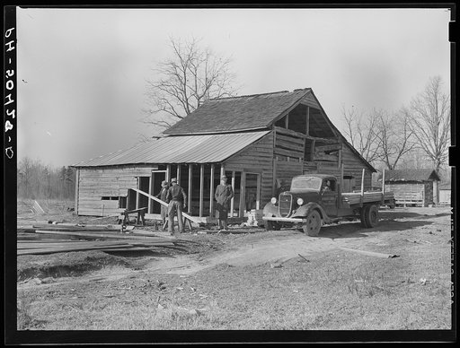 Barn being remodeled on farm purchased for rehabilitation client near Raleigh, North Carolina (county supervisor at right)