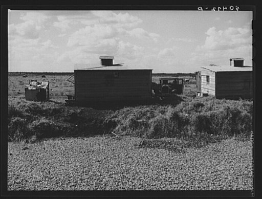 Negro migrant agricultural laborers' shack by canal near Belle Glade, Florida