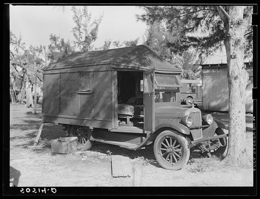 Tom Tom Herb Tonic truck in transient labor cabin and trailer camp. Belle Glade, Florida