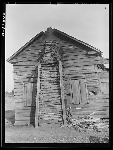 Side view of Negro family's home, showing mud chimney. Near Savannah, Georgia