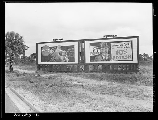 Highway signboard, advertising two of the South's and Florida's standbys