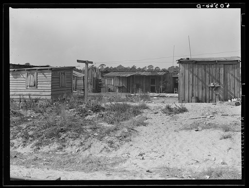 Untitled photo, possibly related to: Negro sawmill workers' homes: no light, no privies, one outdoor water pump for whole camp. Childs, Florida