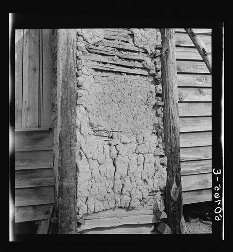 Closeup showing construction of mud chimney on Negro's home. South Carolina