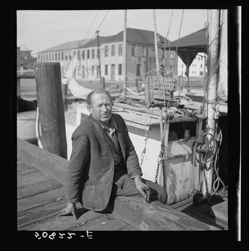 Fisherman on the dock, Charleston, South Carolina, on Christmas Day. He is from Boston and had been repairing motor on boat