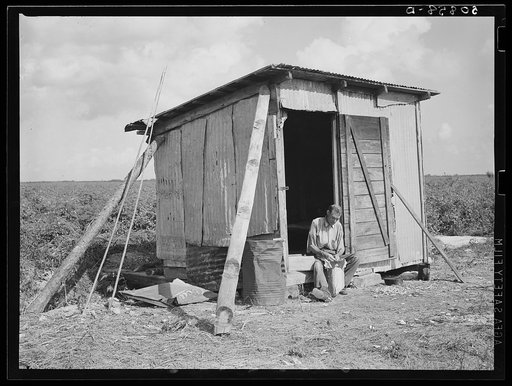 Untitled photo, possibly related to: Old shack, formerly a field house, lived in by migrant agricultural laborer from Tennessee who formerly worked on the railroad. Homestead, Florida