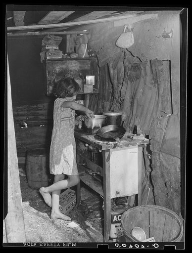 Oldest child of migrant packinghouse worker's family from Tennessee fixing supper. Her mother and father both work during the day and sometimes until two and three in the morning, leaving the children alone. Belle Glade, Florida