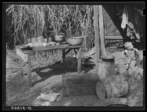 Table for eating and washing outside migrant packinghouse worker's shack. Belle Glade, Florida
