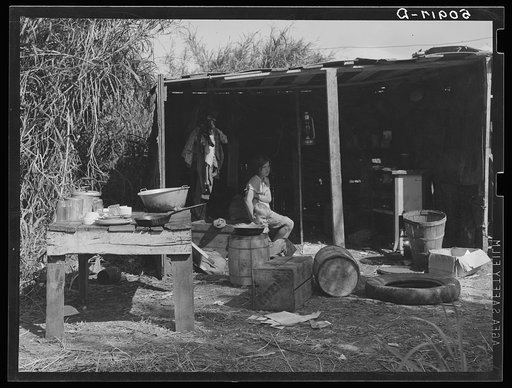 Untitled photo, possibly related to: Table for eating and washing outside migrant packinghouse worker's shack. Belle Glade, Florida