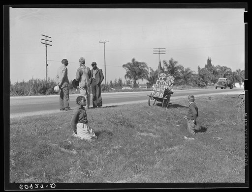 Traveling preacher talking to two Negroes, one whose wife is sick and needs help. Belle Glade, Florida