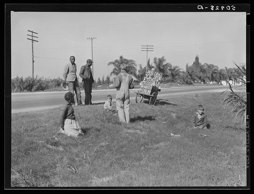 Untitled photo, possibly related to: Traveling preacher talking to two Negroes, one whose wife is sick and needs help. Belle Glade, Florida