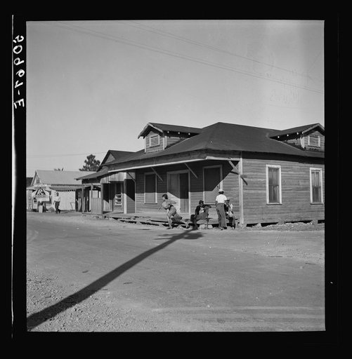 Untitled photo, possibly related to: Main street, showing barber shop in Negro section. Homestead, Florida
