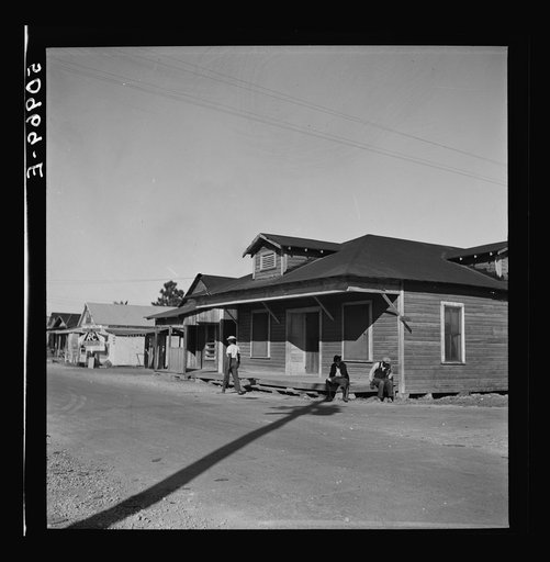Untitled photo, possibly related to: Main street, showing barber shop in Negro section. Homestead, Florida