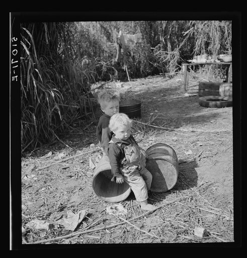 Untitled photo, possibly related to: Child of packinghouse workers from Tennessee, his face covered with black muck which causes an itchy rash. Belle Glade, Florida