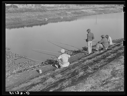 Migratory workers fishing to eat. Belle Glade, Florida