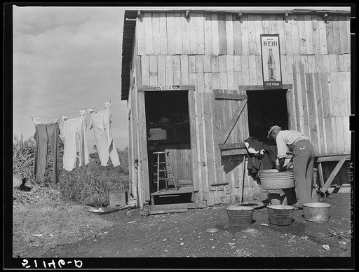 Migrant vegetable pickers. The tailor and cleaner to the laborers near Lake Harbor, Florida