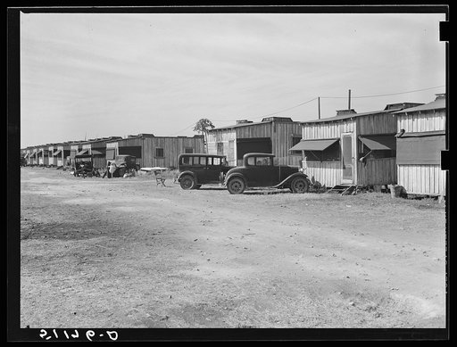 Migratory laborers' camp. Single-room cabin costs two dollars and fifty cents, double room four dollars per week. Water hauled, usually priced at fifty-five cents for fifty-five gallon tank. Toilet for about 150 people. Near Belle Glade, Florida