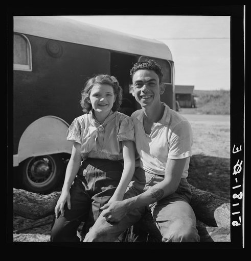 Young couple, migrant laborers, who work in packinghouse at Canal Point, Florida