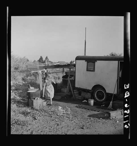 Migrant laborers camped beside a packinghouse in Belle Glade, Florida