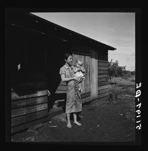 Migrant laborer's wife and child. She is thirty-two years old has had eleven children. See 51187-E. Belle Glade, Florida
