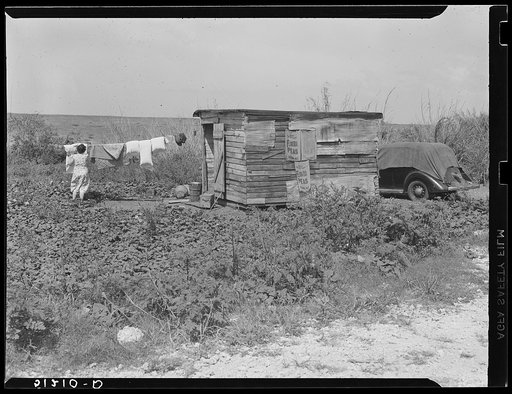 Migrant laborer's shack near Canal Point, Florida