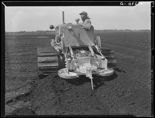A whirling plough used by USSC (United States Sugar Corporation) in soft powdery muck soil to prepare soil for planting sugarcane. Near Pahokee, Florida