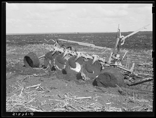 Tractor-driven disc gang plough used on large tracts of land before planting sugarcane. USSC (United States Sugar Corporation). Clewiston, Florida